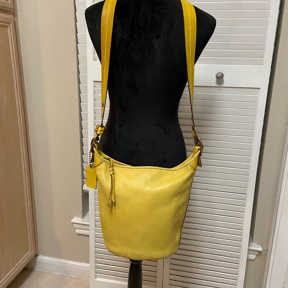 Coach crossbody unique style. Yellow/Lime color. Some spots & signs of wear.